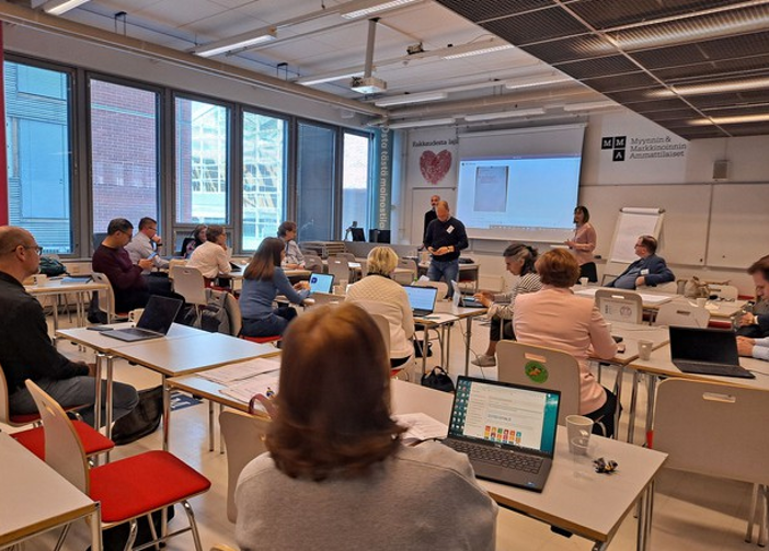 SDG4BIZ Consortium Meeting: people sitting in a class room.